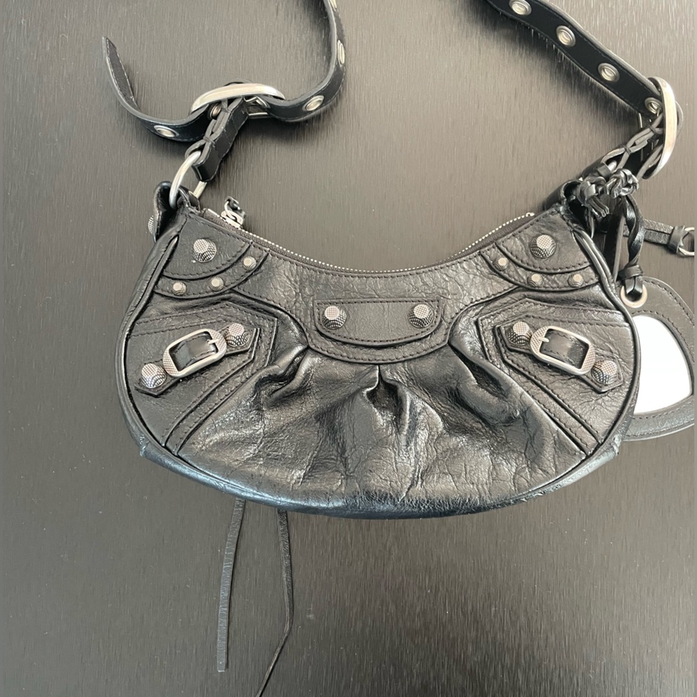 BALENCIAGA
Le Cagole small studded crinkled-leather shoulder bag
